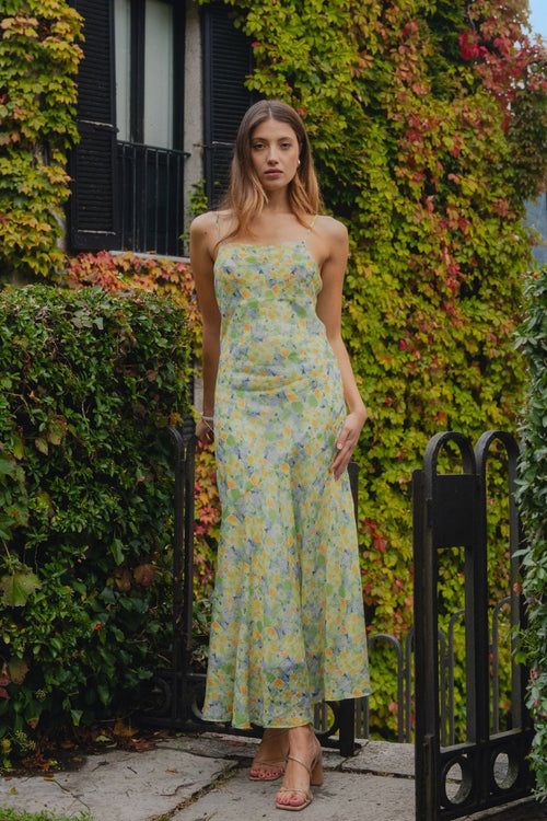 model wears floral green dress