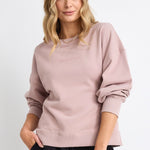 model wears a pink sweatshirt