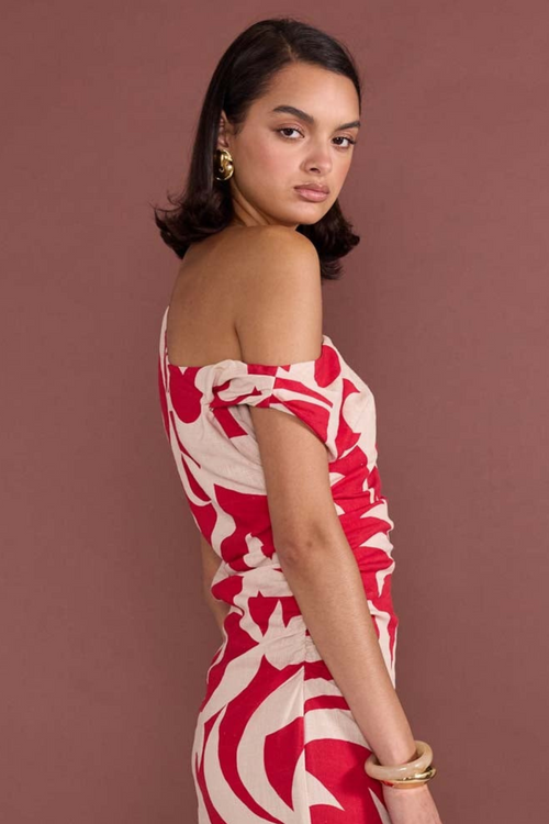 model wears red floral midi dress