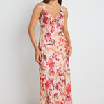 Model wears a strappy floral blush maxi dress