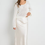 model wears White Pearl Satin Midi Skirt