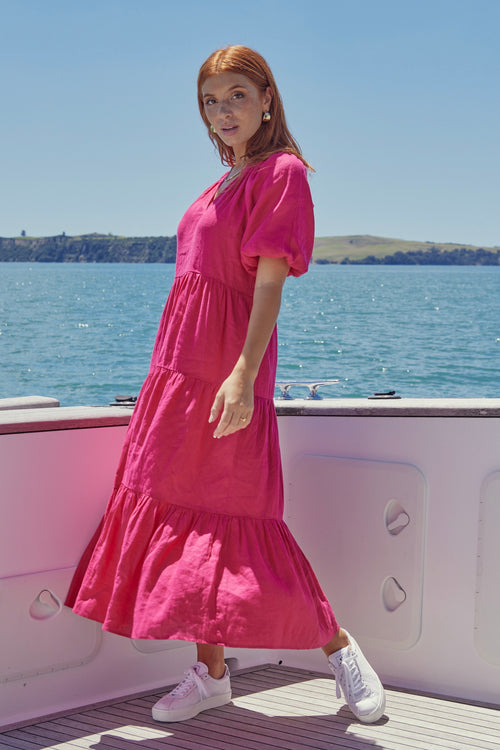 model wears a pink maxi dress