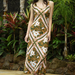 model wears green print maxi dress