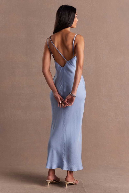 model wears a blue maxi dress