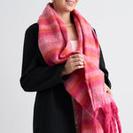 Model wears a pink and orange scarf