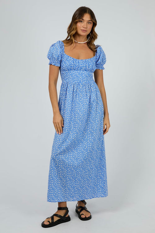 model wears a blue spot maxi dress