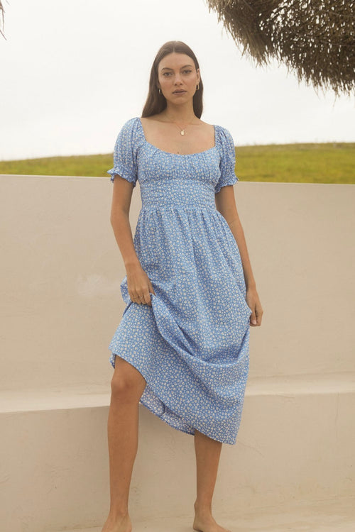 model wears a blue spot maxi dress