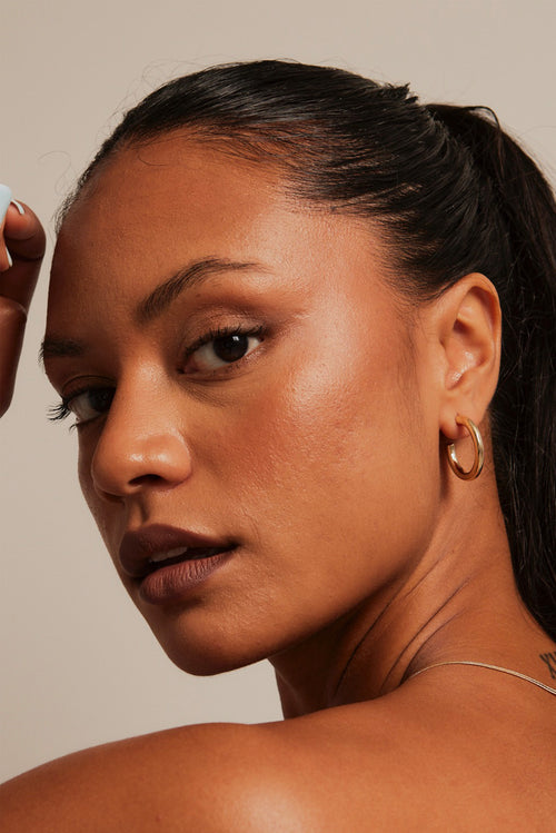 model wearing Thick Classic Gold Hoop Earrings