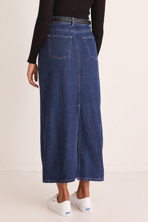 model wears a blue denim maxi skirt