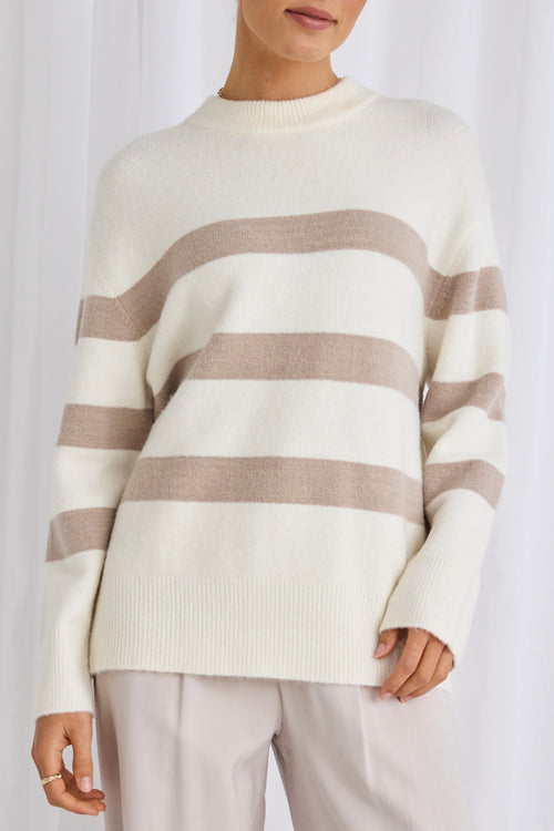 model wears a white stripe knit 