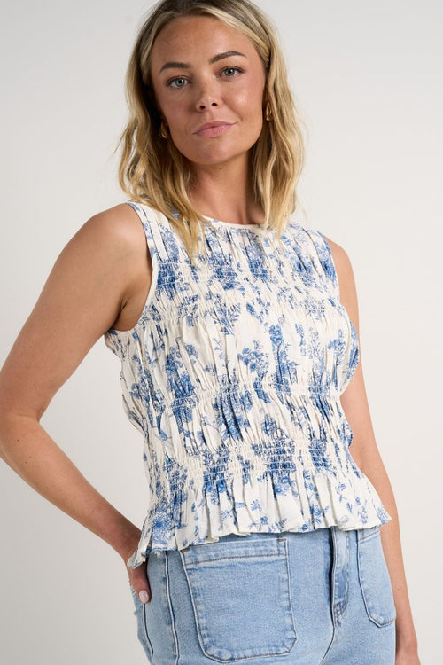 model wears Blue & White Top