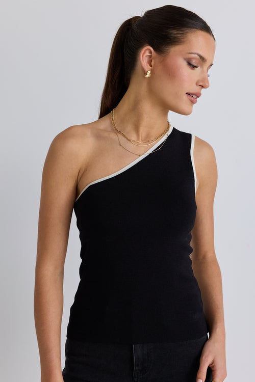 model wears black one shoulder top with black jeans