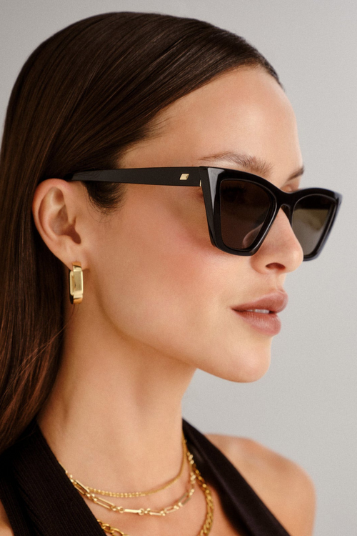 model wears black sunglasses