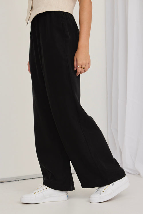 model wears black pants