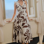 model wears floral brown and white cotton maxi dress