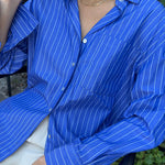 model wears a blue stripe shirt