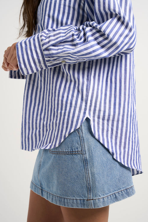 Model wears blue stripe shirt 