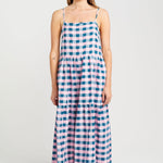 model wears blue and pink check maxi dress