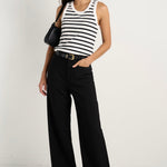 model wears black wide leg pants