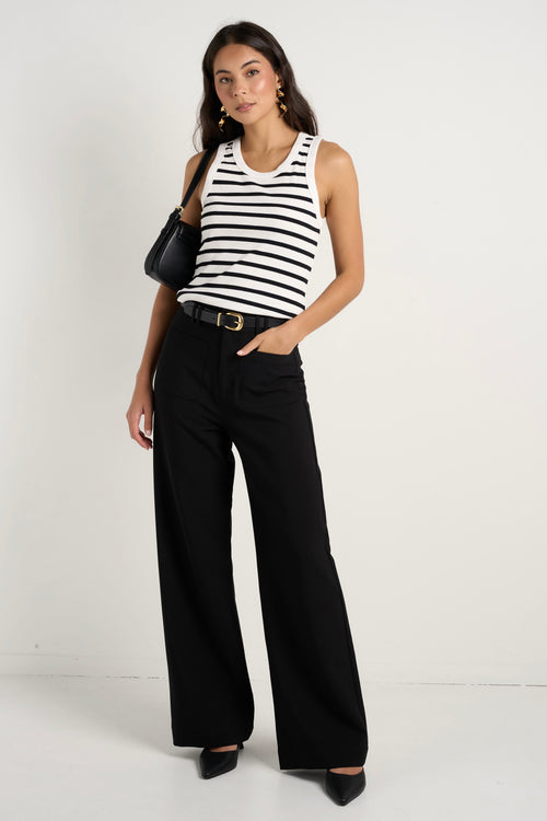 model wears black wide leg pants