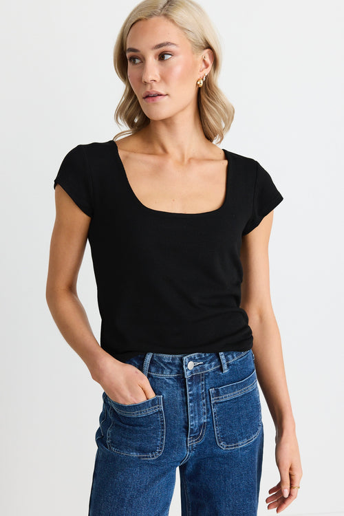 model wears a black top