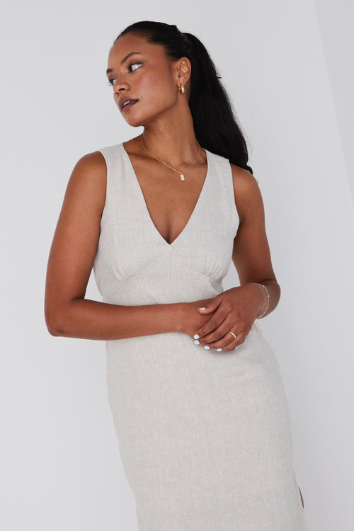 model wears linen v neck midi dress