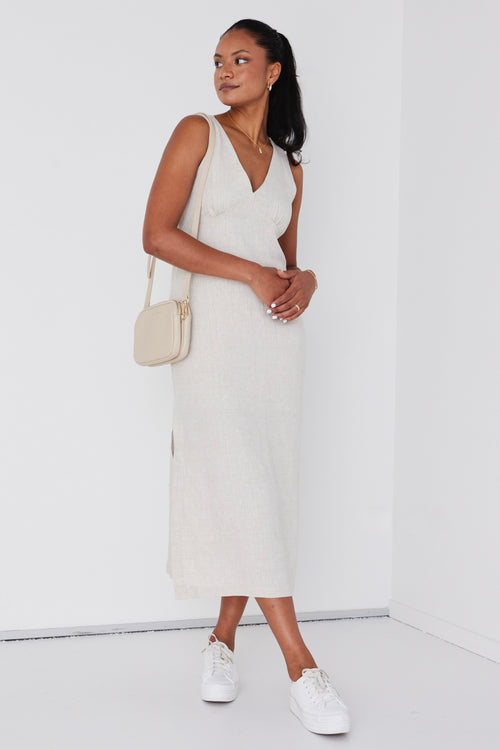 model wears linen v neck midi dress