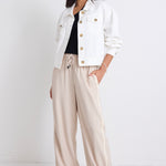 model wears a white jacket