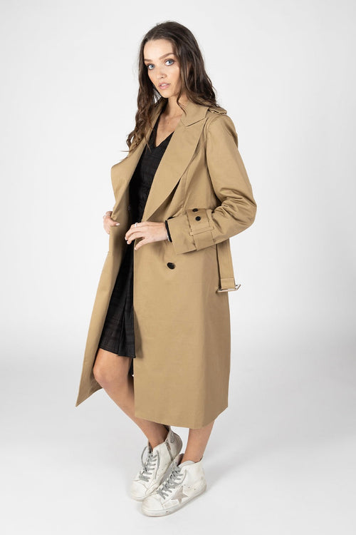 Model wears a Tan Trench Coat