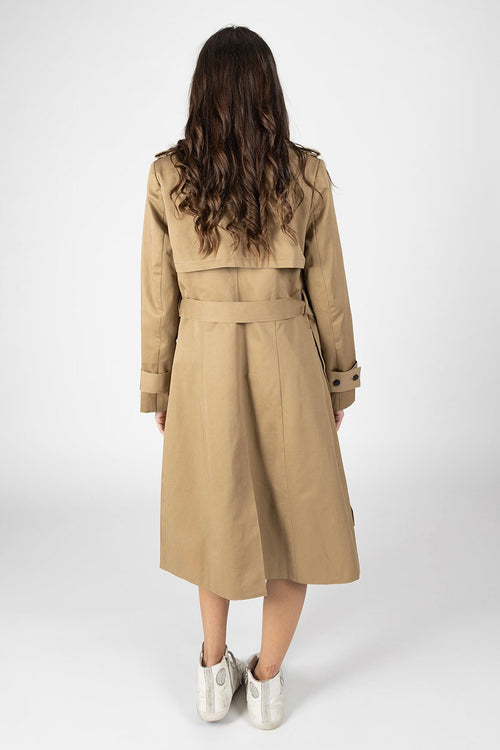 Model wears a Tan Trench Coat