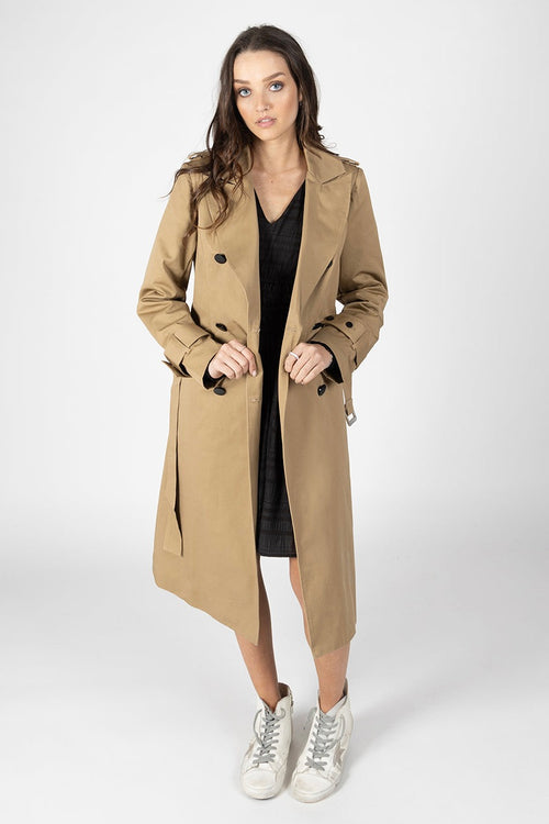 Model wears a Tan Trench Coat