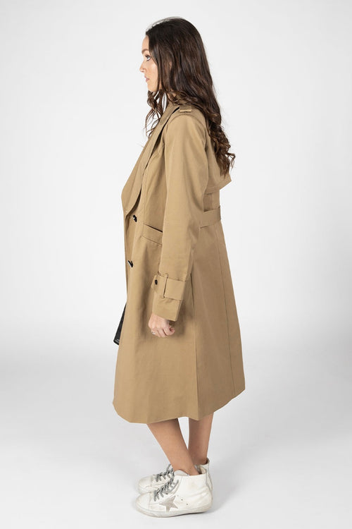 Model wears a Tan Trench Coat