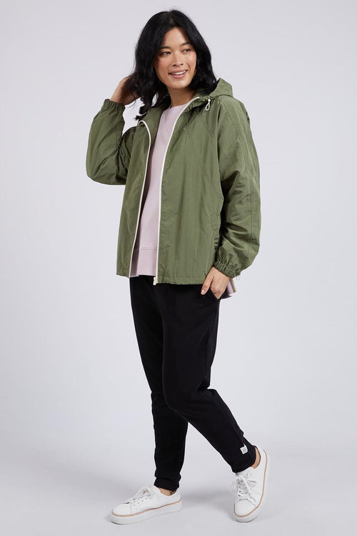 model wears a green jacket