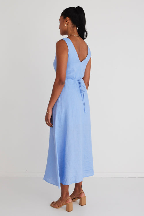 model is wearing a blue linen dress