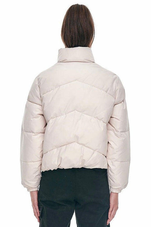 model wears a white puffer jacket