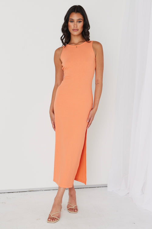 model in orange ribbed midi dress and heels