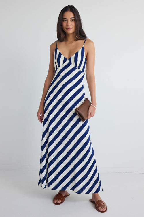 model wears navy and white stripe slip midi dress