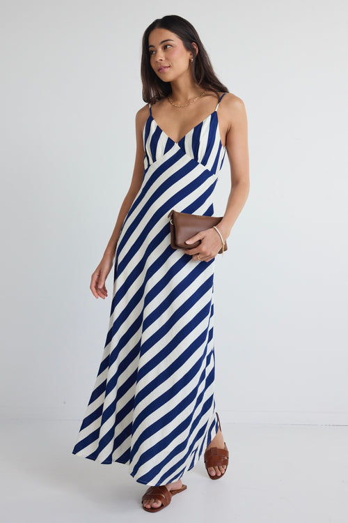 model wears navy and white stripe slip midi dress