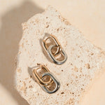 gold and silver earring 