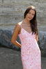 model wears pink midi dress