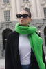 model wears a green scarf