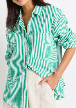 model wears a green stripe shirt