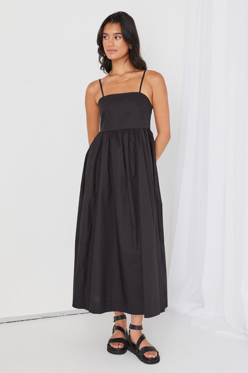 model wears black cotton maxi dress