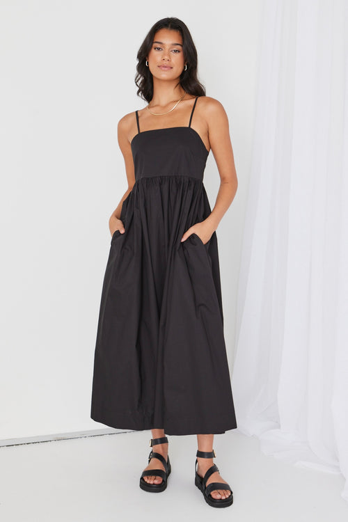 model wears black cotton maxi dress